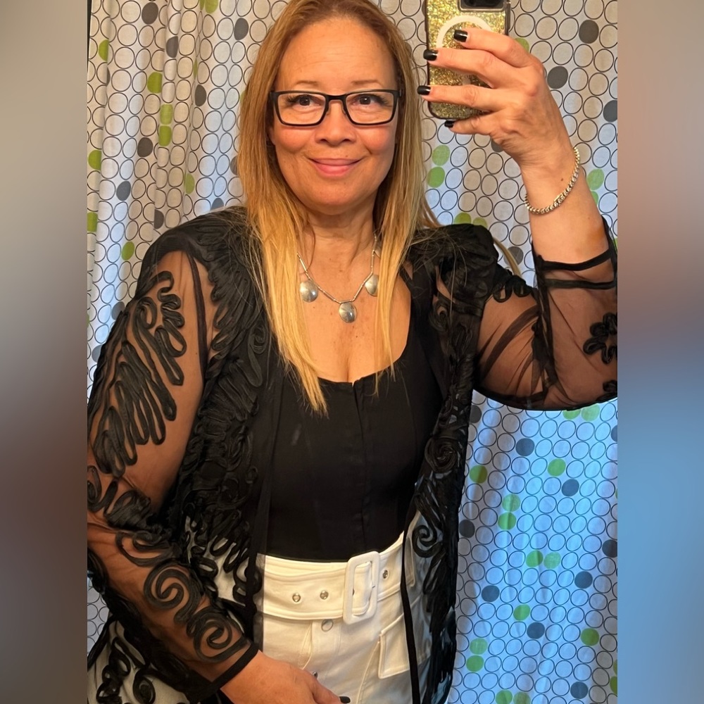 Vintage, sheer top with shoulder pads.